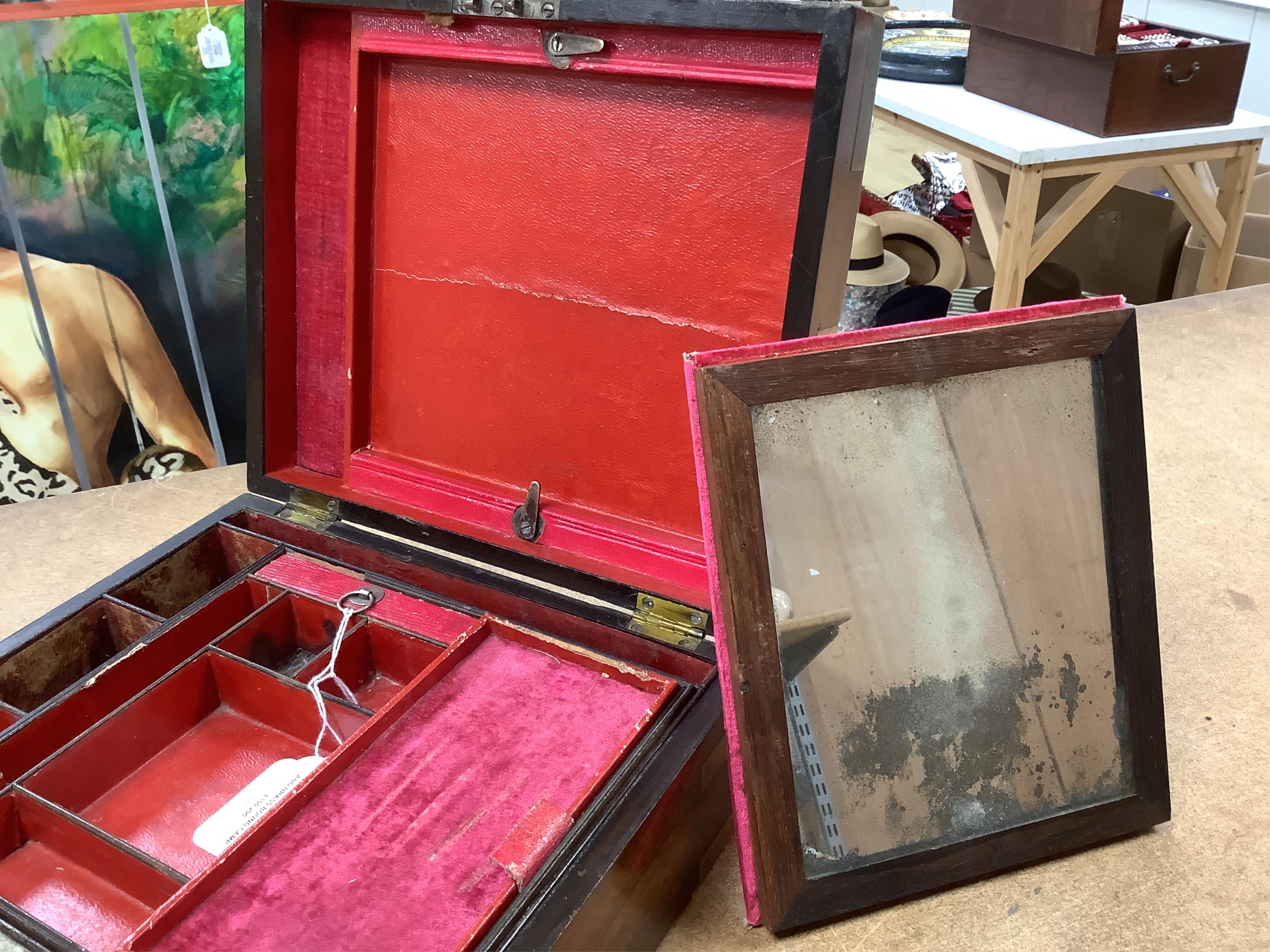 A George IV mahogany and brass bound campaign vanity box with original fittings, 27cm wide x 23cm deep x 10cm high